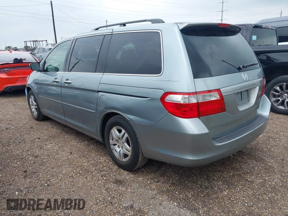 2005 Honda Odyssey EX with VIN 5FNRL38415B104920, listed as a IAAI auction lot 42094690 with 228,538 mi miles. Bid and sale history available at carsss.com. Image 3.