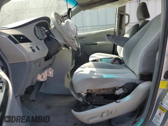 2012 Toyota Sienna LE AAS with VIN 5TDKK3DC2CS207404, listed as a Copart auction lot 62781215 with 200,757 mi miles and Salvage title. Bid and sale history available at DreamBid. Image 7.