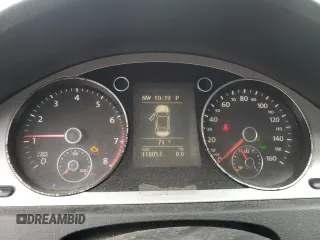 2009 Volkswagen Passat z VIN WVWXK73C39E138994, wystawiony jako Copart lot #70876274 z przebiegiem 118 057 mil mil oraz Czysty tytuł • Clean title. Historia ofert i sprzedaży dostępna na DreamBid. Obrazek 9.