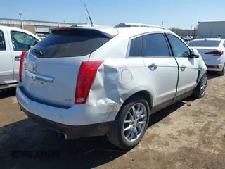 2014 Cadillac SRX Performance Collection with VIN 3GYFNCE38ES675508, listed as a IAAI auction lot 41969292 with 147,534 mi miles and . Bid and sale history available at DreamBid. Image 4.