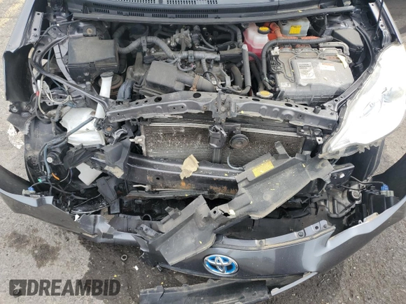 2014 Toyota Prius One z VIN JTDKDTB33E1066355, wystawiony jako Copart lot #58524285 z przebiegiem Nie podano mil oraz Szkoda całkowita • Salvage title. Historia ofert i sprzedaży dostępna na DreamBid. Obrazek 11.