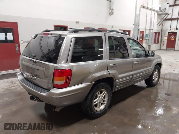 1999 Jeep Grand Cherokee Limited with VIN 1J4GW68N7XC752314, listed as a IAAI auction lot 41776905 with 228,023 mi miles. Bid and sale history available at carsss.com. Image 4.