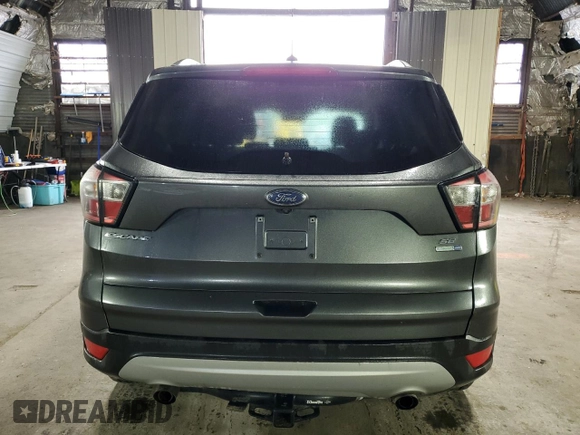 2018 Ford Escape SE z VIN 1FMCU9GD7JUA68705, wystawiony jako Copart lot #58275145 z przebiegiem 200 695 mil mil oraz Tytuł czysty. Historia ofert i sprzedaży dostępna na DreamBid. Obrazek 6.