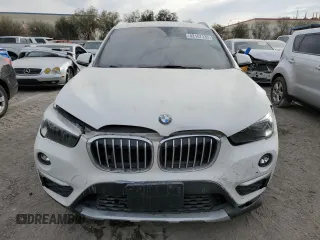2018 BMW X1 sDrive28i with VIN WBXHU7C37J5H44386, listed as a Copart auction lot 42167135 with 96,668 mi miles and Salvage Title. Bid and sale history available at DreamBid. Image 5.