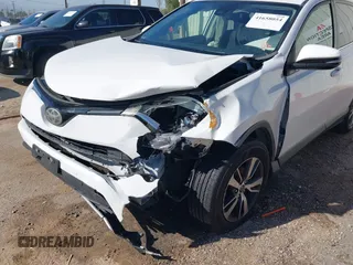 2017 Toyota RAV4 XLE with VIN JTMWFREV9HJ128521, listed as a IAAI auction lot 41658054 with 106,788 mi miles and . Bid and sale history available at DreamBid. Image 6.