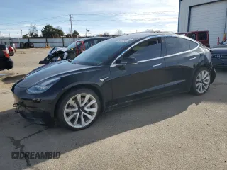 2019 Tesla Model 3 Mid Range with VIN 5YJ3E1EA8KF310763, listed as a Copart auction lot 49677785 with 69,516 mi miles and Clean Title. Bid and sale history available at carsss.com. Image 1.