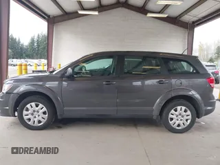 2015 Dodge Journey SE z VIN 3C4PDCAB1FT617794, wystawiony jako IAAI lot #41922371 z przebiegiem 130 558 mil mil oraz . Historia ofert i sprzedaży dostępna na DreamBid. Obrazek 15.