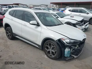 2019 BMW X1 sDrive28i z VIN WBXHU7C5XK3H45207, wystawiony jako IAAI lot #42296664 z przebiegiem 39 093 mil mil oraz . Historia ofert i sprzedaży dostępna na DreamBid. Obrazek 1.