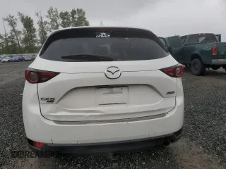 2019 Mazda CX-5 Grand Touring with VIN JM3KFBDM4K0669589, listed as a Copart auction lot 54948455 with 64,475 mi miles and Salvage Title. Bid and sale history available at carsss.com. Image 6.