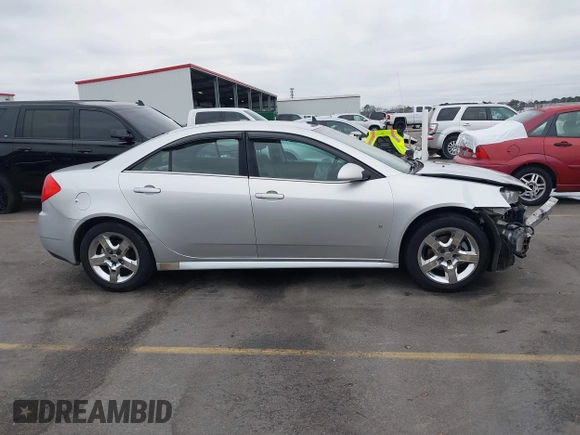 2009 Pontiac G6 1SB z VIN 1G2ZJ57B994252266, wystawiony jako IAAI lot #41609938 z przebiegiem 162 412 mil mil oraz . Historia ofert i sprzedaży dostępna na DreamBid. Obrazek 13.