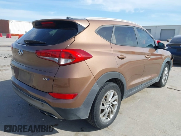 2016 Hyundai Tucson Limited with VIN KM8J33A20GU137662, listed as a IAAI auction lot 41818149 with 120,010 mi miles. Bid and sale history available at carsss.com. Image 4.