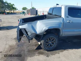 2021 Toyota Tacoma SR5 with VIN 5TFAZ5CN7MX101810, listed as a IAAI auction lot 42454418 with 58,930 mi miles and . Bid and sale history available at DreamBid. Image 6.