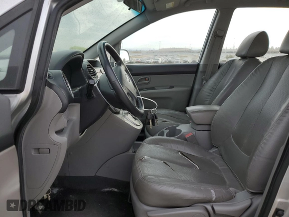 2009 Kia Rondo LX Base with VIN KNAFG528097222268, listed as a Copart auction lot 77797124 with 184,569 mi miles and Salvage Title. Bid and sale history available at carsss.com. Image 7.