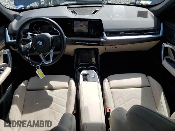 2023 BMW X1 xDrive28i with VIN WBX73EF05P5Y21721, listed as a Copart auction lot 50749295 with 10,633 mi miles and Salvage title. Bid and sale history available at DreamBid. Image 8.