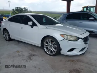 2014 Mazda 6 i Touring with VIN JM1GJ1V64E1154243, listed as a IAAI auction lot 42500402 with 240,961 mi miles and . Bid and sale history available at DreamBid. Image 1.