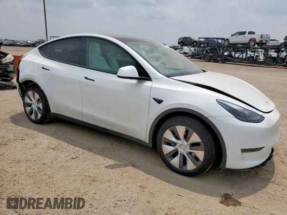 2024 Tesla Model Y Long Range with VIN 7SAYGDEE6RA290124, listed as a Copart auction lot 57662385 with 14,751 mi miles and Salvage title. Bid and sale history available at DreamBid. Image 4.