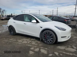 2021 Tesla Model Y Performance with VIN 5YJYGDEF4MF201815, listed as a Copart auction lot 42453075 with 76,888 mi miles and Salvage Title. Bid and sale history available at DreamBid. Image 4.