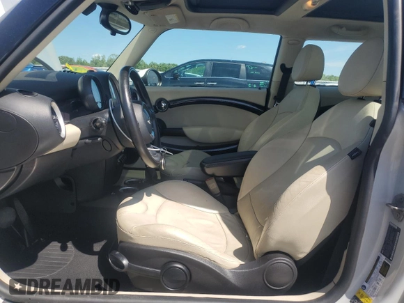 2011 MINI Hardtop with VIN WMWSU3C5XBTX96048, listed as a Copart auction lot 57607955 with 99,632 mi miles and Salvage title. Bid and sale history available at DreamBid. Image 7.