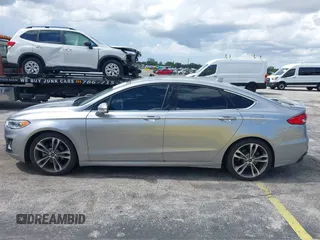 2020 Ford Fusion Titanium with VIN 3FA6P0D95LR199443, listed as a IAAI auction lot 42721371 with 77,592 mi miles and . Bid and sale history available at DreamBid. Image 14.