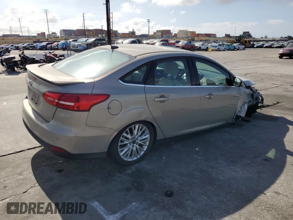 2015 Ford Focus Titanium с VIN 1FADP3J28FL288037, выставлен на аукционе Copart как лот 56972865 с пробегом 75 703 миль миль и Списание • Salvage title. История ставок и продаж доступна на DreamBid. Изображение 3.
