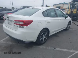 2021 Subaru Impreza Premium with VIN 4S3GKAV61M3604298, listed as a IAAI auction lot 42011198 with 50,667 mi miles and . Bid and sale history available at DreamBid. Image 4.