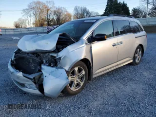 2012 Honda Odyssey Touring with VIN 5FNRL5H9XCB027758, listed as a Copart auction lot 86058504 with 164,860 mi miles and Salvage Title. Bid and sale history available at DreamBid. Image 1.