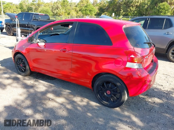2009 Toyota Yaris with VIN JTDJT903695234623, listed as a IAAI auction lot 42027852 with 146,000 mi miles. Bid and sale history available at carsss.com. Image 3.