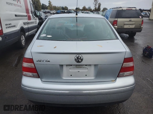 2004 Volkswagen Jetta GL z VIN 3VWRK69M54M030184, wystawiony jako Copart lot #77764124 z przebiegiem 97 634 mil mil oraz Szkoda całkowita • Salvage title. Historia ofert i sprzedaży dostępna na DreamBid. Obrazek 6.