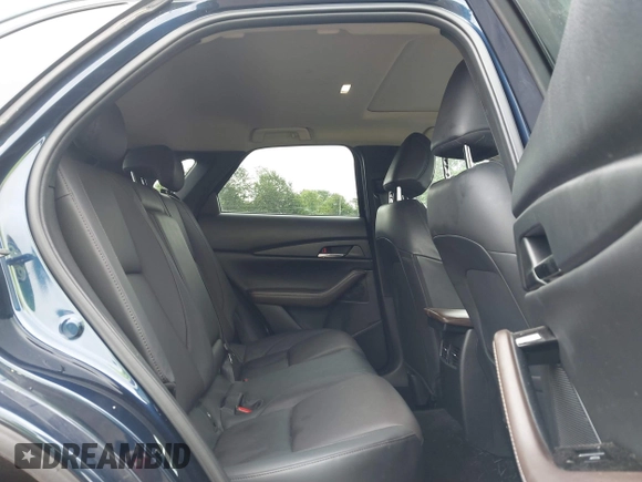 2022 Mazda CX-30 S Premium with VIN 3MVDMBDL0NM413545, listed as a IAAI auction lot 42493594 with 57,013 mi miles and . Bid and sale history available at DreamBid. Image 8.