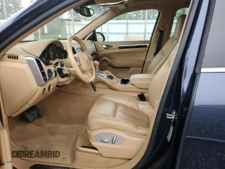 2014 Porsche Cayenne S Hybrid z VIN WP1AE2A20ELA51052, wystawiony jako Copart lot #59554375 z przebiegiem 97 687 mil mil oraz Szkoda całkowita • Salvage title. Historia ofert i sprzedaży dostępna na DreamBid. Obrazek 7.