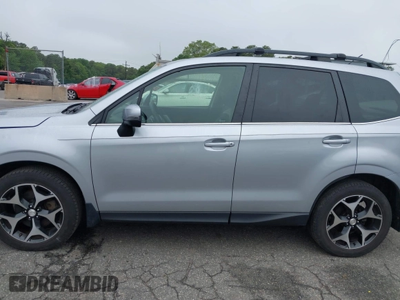 2014 Subaru Forester XT Touring with VIN JF2SJGMC1EH552474, listed as a IAAI auction lot 42461663 with 121,482 mi miles and . Bid and sale history available at DreamBid. Image 14.