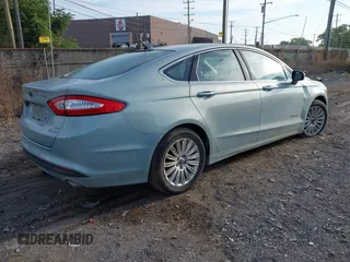 2014 Ford Fusion SE Hybrid with VIN 3FA6P0LU2ER168949, listed as a IAAI auction lot 40366468 with 188,802 mi miles. Bid and sale history available at carsss.com. Image 4.