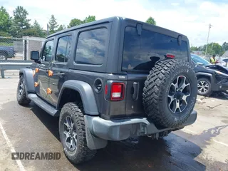 2019 Jeep Wrangler Unlimited Sport S with VIN 1C4HJXDN4KW577273, listed as a IAAI auction lot 42435847 with 69,403 mi miles and . Bid and sale history available at DreamBid. Image 3.