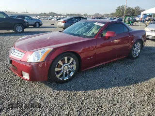 2006 Cadillac XLR z VIN 1G6YV36A465601366, wystawiony jako Copart lot #76229944 z przebiegiem 33 159 mil mil oraz Nie do naprawy. Historia ofert i sprzedaży dostępna na DreamBid. Obrazek 1.