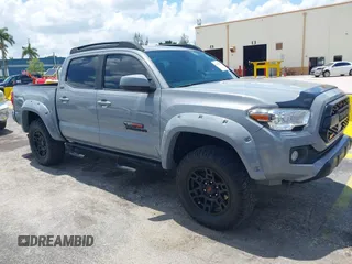 2020 Toyota Tacoma SR5 with VIN 3TMAZ5CN8LM131869, listed as a IAAI auction lot 42688235 with 148,779 mi miles and . Bid and sale history available at DreamBid. Image 1.