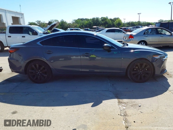 2021 Mazda 6 Carbon Edition with VIN JM1GL1WY4M1619533, listed as a IAAI auction lot 41979213 with 84,783 mi miles and . Bid and sale history available at DreamBid. Image 13.
