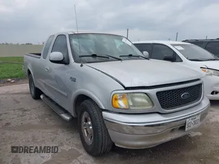 2003 Ford F-150 XL with VIN 2FTRX17223CA73626, listed as a IAAI auction lot 42027926 with 127,614 mi miles. Bid and sale history available at carsss.com. Image 1.