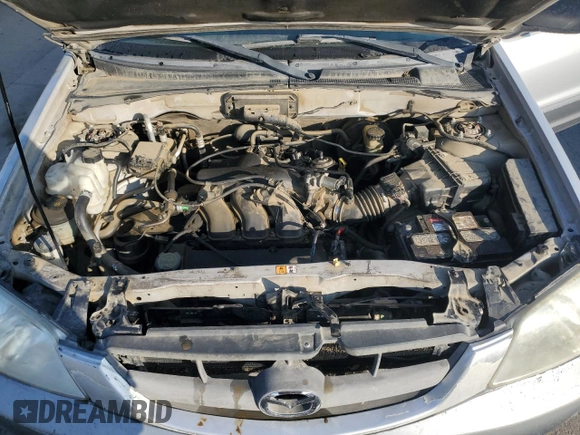 2002 Mazda Tribute LX with VIN 4F2YU09152KM50320, listed as a Copart auction lot 88131405 with 238,013 mi miles and Salvage Title. Bid and sale history available at carsss.com. Image 12.