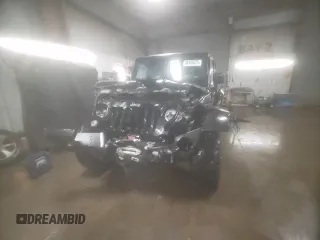2015 Jeep Wrangler Unlimited Rubicon Hard Rock with VIN 1C4HJWFG4FL676868, listed as a Copart auction lot 48489525 with 100,771 mi miles and Salvage title. Bid and sale history available at DreamBid. Image 14.