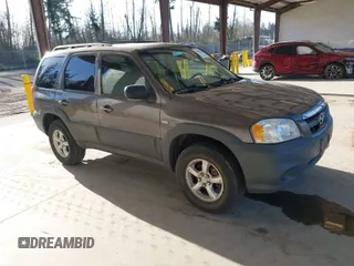 2006 Mazda Tribute i with VIN 4F2YZ02Z26KM12180, listed as a IAAI auction lot 41959606 with 228,217 mi miles and . Bid and sale history available at carsss.com. Image 1.
