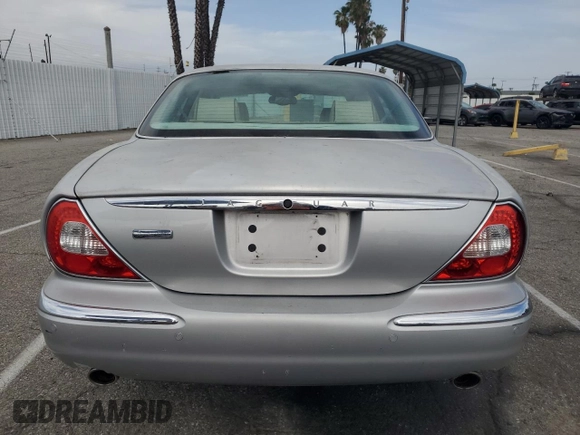 2004 Jaguar XJ Vanden Plas with VIN SAJWA74C04SG25291, listed as a Copart auction lot 56678255 with 176,597 mi miles and Clean Title. Bid and sale history available at DreamBid. Image 6.