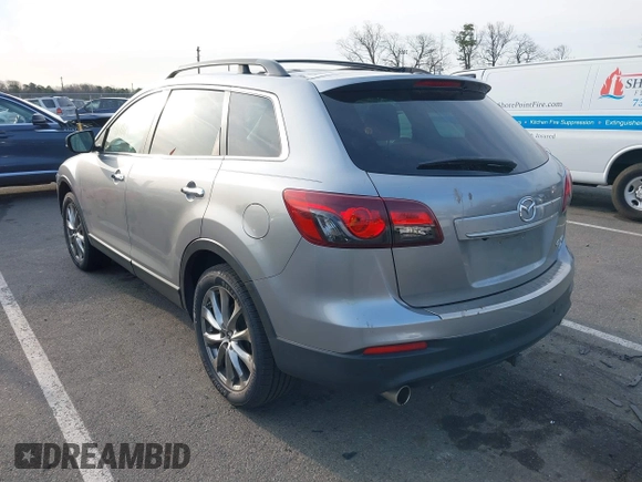 2015 Mazda CX-9 Grand Touring with VIN JM3TB3DA6F0447184, listed as a IAAI auction lot 41771865 with 137,814 mi miles. Bid and sale history available at carsss.com. Image 3.