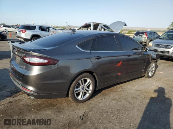 2016 Ford Fusion SE Hybrid z VIN 3FA6P0LU2GR342876, wystawiony jako Copart lot #65036385 z przebiegiem 118 832 mil mil oraz Czysty tytuł • Clean title. Historia ofert i sprzedaży dostępna na DreamBid. Obrazek 3.