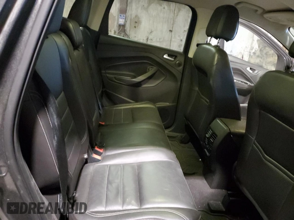 2016 Ford Escape SE z VIN 1FMCU9G98GUB07175, wystawiony jako Copart lot #44966825 z przebiegiem 118 727 mil mil oraz Szkoda całkowita • Salvage title. Historia ofert i sprzedaży dostępna na DreamBid. Obrazek 11.