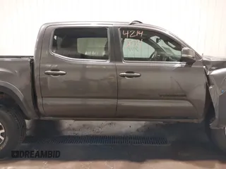 2019 Toyota Tacoma SR with VIN 5TFCZ5AN7KX208672, listed as a IAAI auction lot 42143071 with 83,584 mi miles and . Bid and sale history available at DreamBid. Image 14.