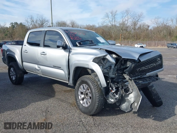 2018 Toyota Tacoma SR5 with VIN 5TFAZ5CN6JX057889, listed as a IAAI auction lot 41449604 with 114,888 mi miles and . Bid and sale history available at DreamBid. Image 1.