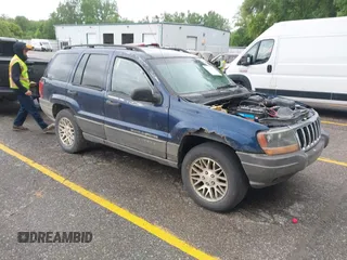 2002 Jeep Grand Cherokee Laredo with VIN 1J4GW48S32C118579, listed as a IAAI auction lot 42522367 with 271,379 mi miles and . Bid and sale history available at DreamBid. Image 1.