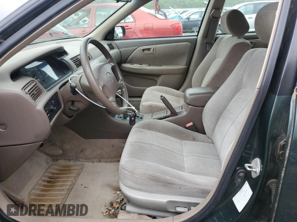 2000 Toyota Camry CE z VIN 4T1BG22K4YU977012, wystawiony jako Copart lot #59085085 z przebiegiem 146 838 mil mil oraz Szkoda całkowita • Salvage title. Historia ofert i sprzedaży dostępna na DreamBid. Obrazek 7.