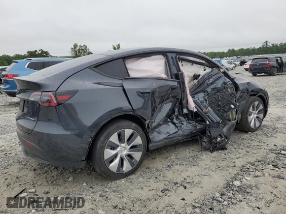 2024 Tesla Model Y Long Range with VIN 7SAYGAEE7RF005786, listed as a Copart auction lot 58415195 with 8,700 mi miles and Salvage title. Bid and sale history available at DreamBid. Image 3.