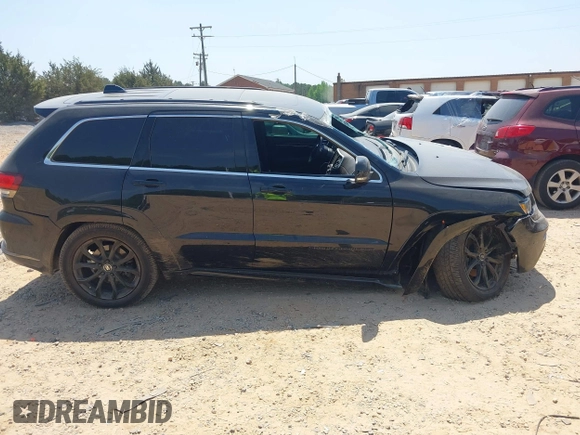 2016 Jeep Grand Cherokee Overland with VIN 1C4RJFCG5GC408390, listed as a IAAI auction lot 42140038 with 140,507 mi miles and . Bid and sale history available at DreamBid. Image 13.